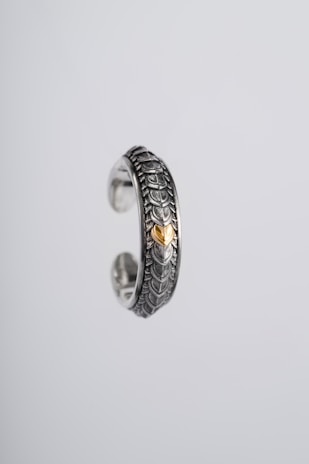 Close-up of a delicate electroformed gold ring showcasing intricate craftsmanship.