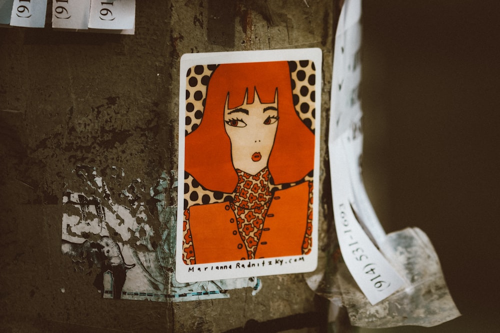a picture of a woman with red hair on a piece of paper