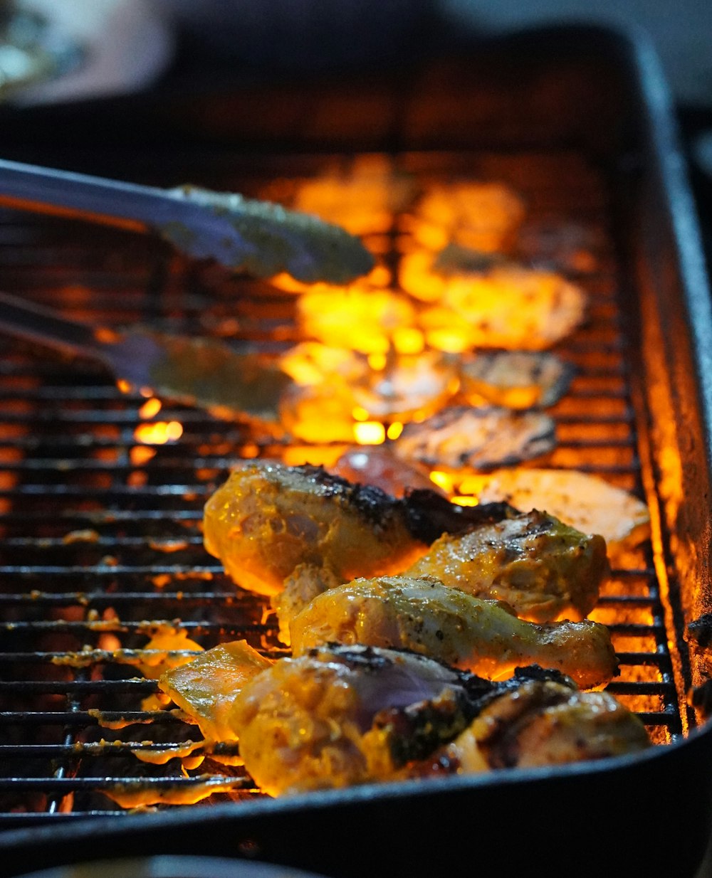 a close up of food cooking on a grill