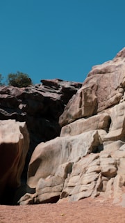 A scenic Alberta landscape with geological formations under a clear blue sky.