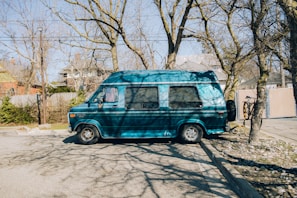 A mobile service van parked outside a customer's home.