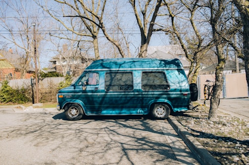 A mobile service van parked outside a customer's home.