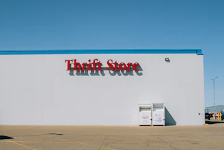 a thrift store sign on the side of a building