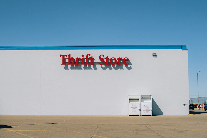 a thrift store sign on the side of a building
