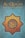 The cover features a geometric star design with intricate patterns in orange and gold, centered on a blue background. Arabic calligraphy is prominently displayed in the center within the geometric pattern. Above the design, the title 'Al-Qur'an Dan Terjemahnya' is printed in yellow text.