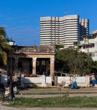 Vintage Cuban cigar factory photo juxtaposed with modern Ybor City streetscape.