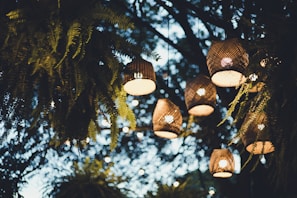 Evening lanterns glowing softly around the garden villa creating a tranquil ambiance.