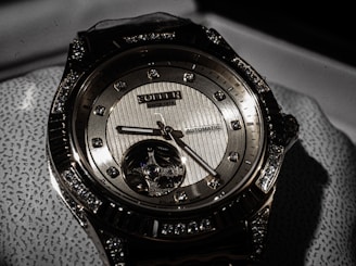 a close up of a watch on a cloth