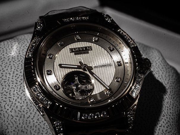 a close up of a watch on a cloth