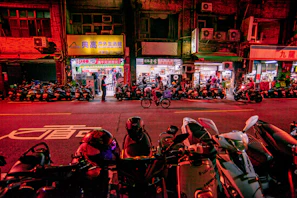A vibrant street scene in Vietnam, alive with colorful scooters and warm afternoon light.
