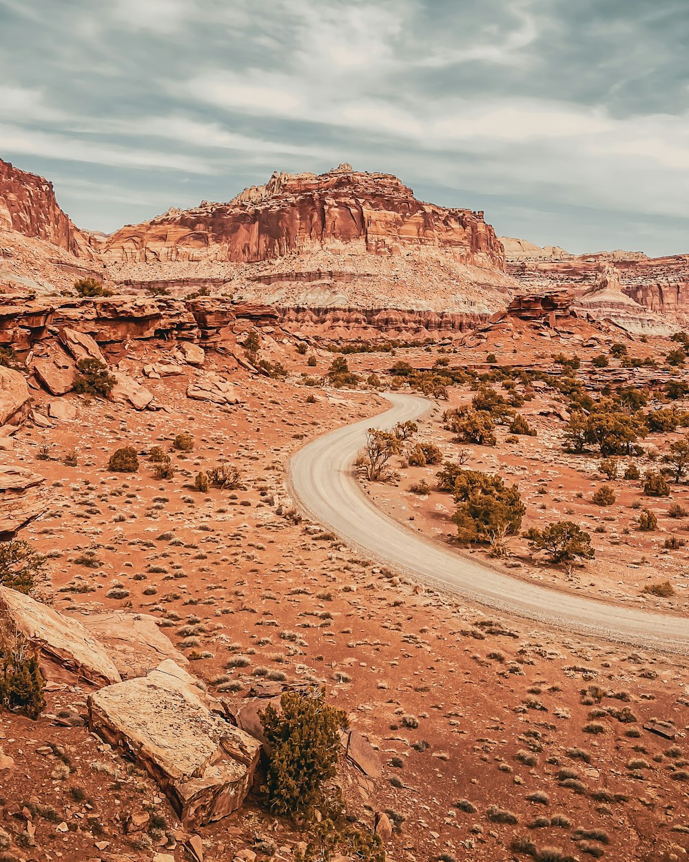 a dirt road in the middle of a desert