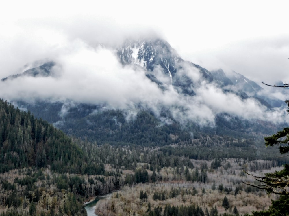 a view of a mountain range with a river in the foreground