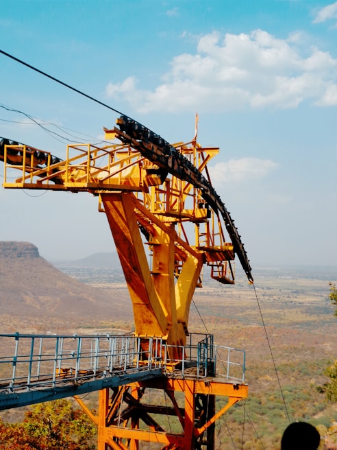 Wide shot of a large steel support structure assembled outdoors at a mining site
