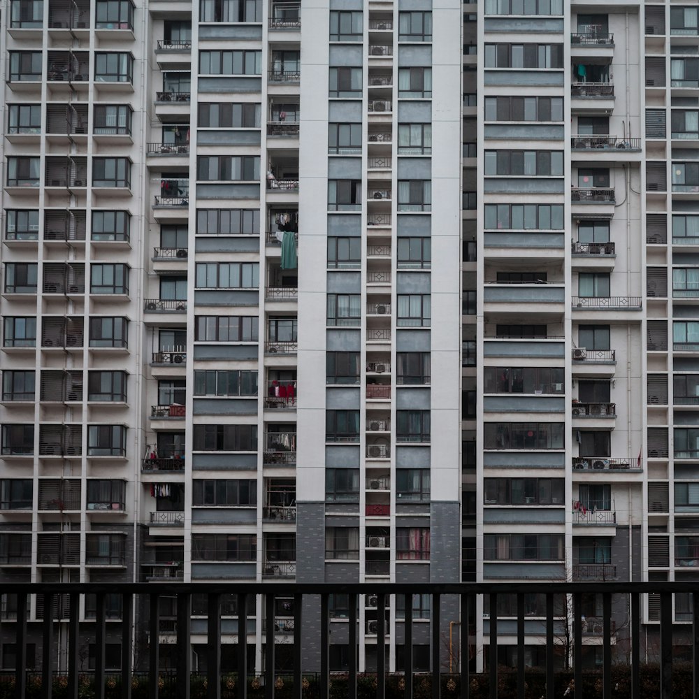 a tall building with lots of windows and balconies