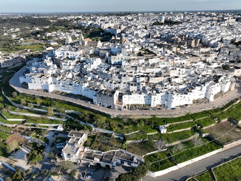 Historic whitewashed village nestled in the mountains with cobblestone streets.