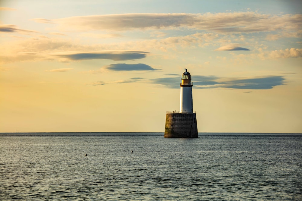 a light house in the middle of the ocean