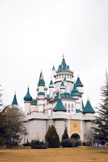 A whimsical castle floating among the clouds with children looking out from the windows.