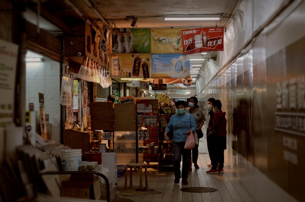 a group of people standing around a store