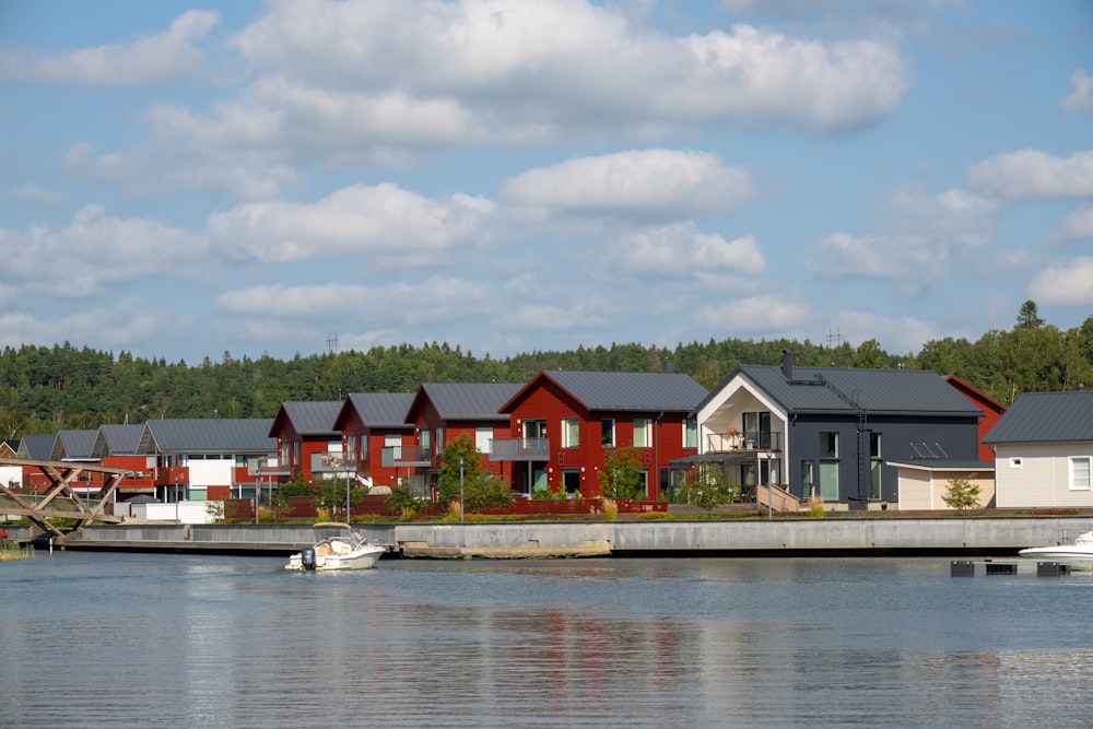 a row of houses sitting on top of a lake
