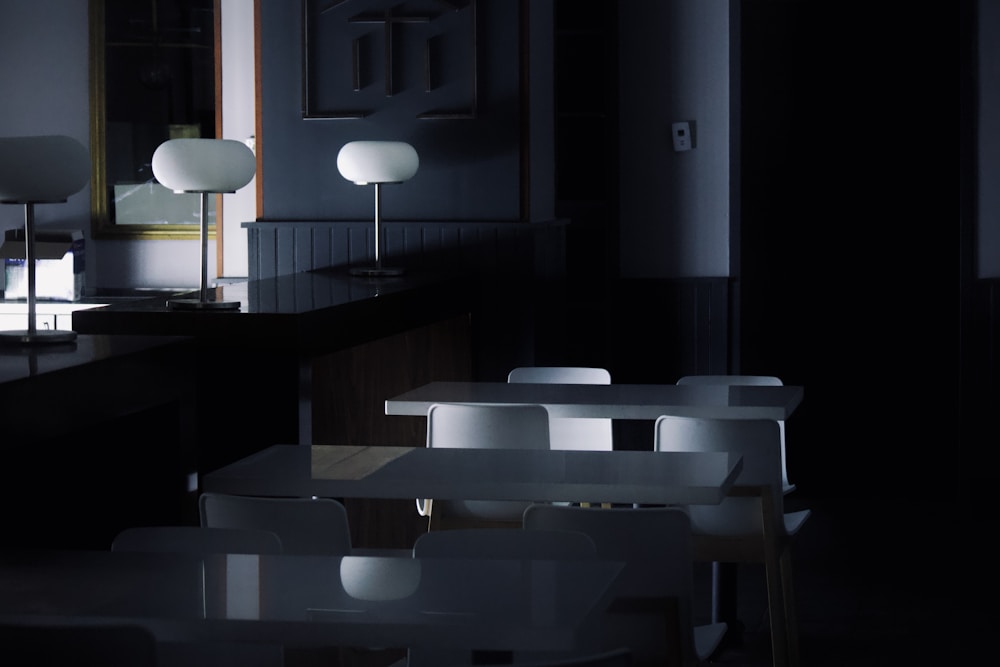 Dark dining room laid and lit