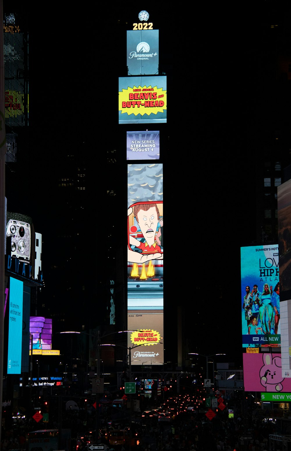 a city at night with a lot of billboards