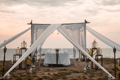 A beautifully set dining table in a rice field under the stars.