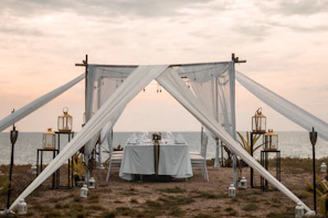 Romantic candlelit dinner setup under the stars with traditional Malagasy decor
