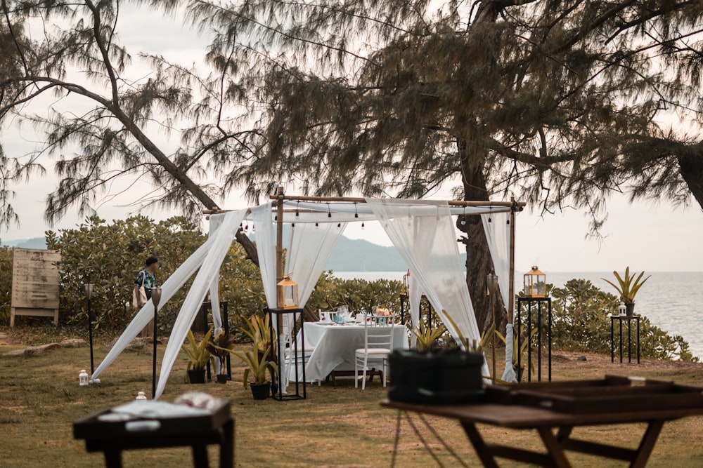 a gazebo set up for a wedding with a view of the ocean