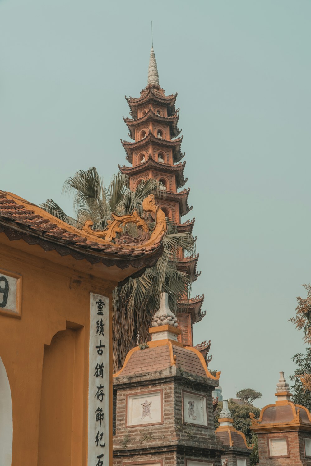 a tall tower with a clock on it's side