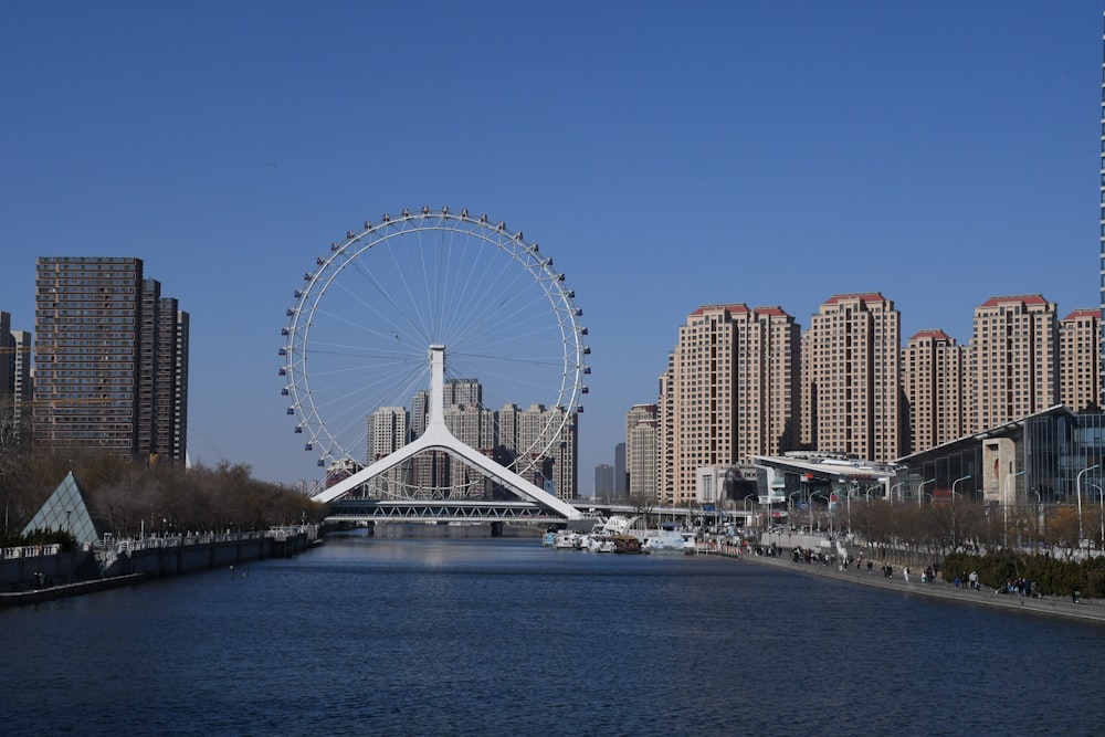 a large ferris wheel in the middle of a city