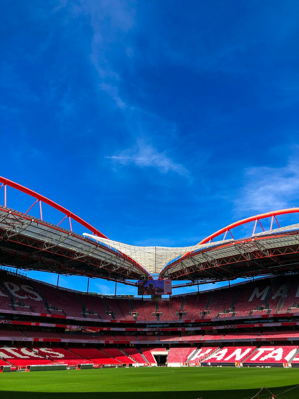 a soccer field with a blue sky in the background