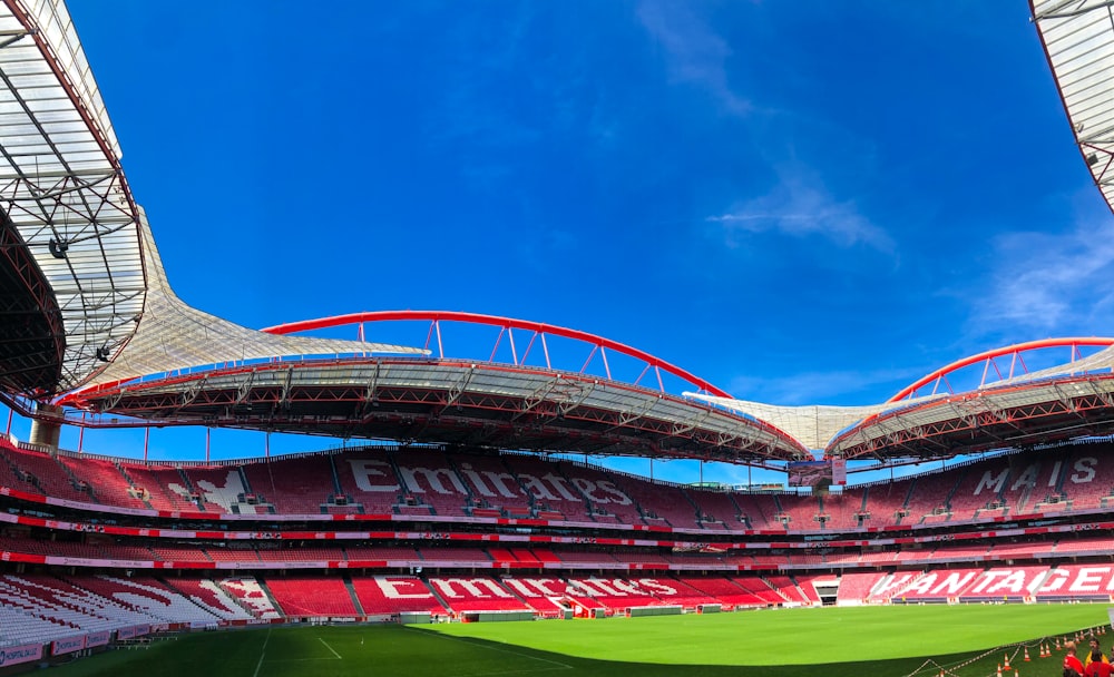 a soccer stadium with a blue sky in the background