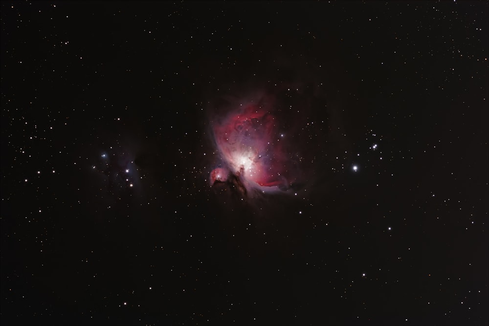 a large star cluster in the middle of a night sky