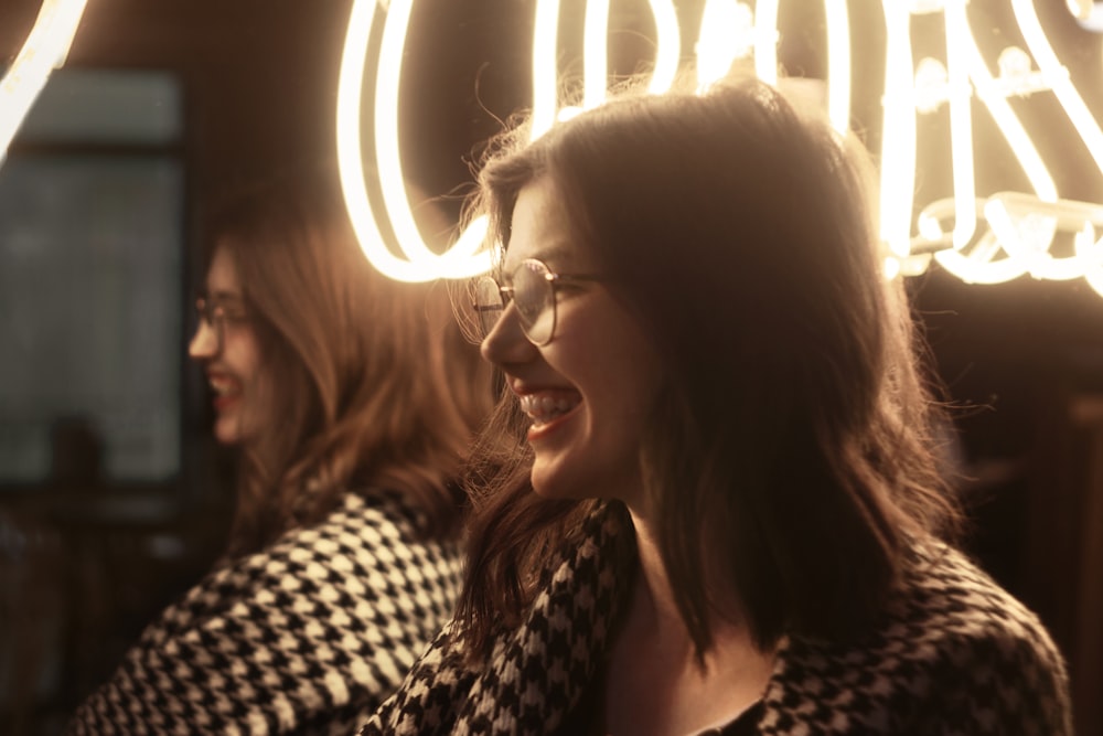 a couple of women standing next to each other