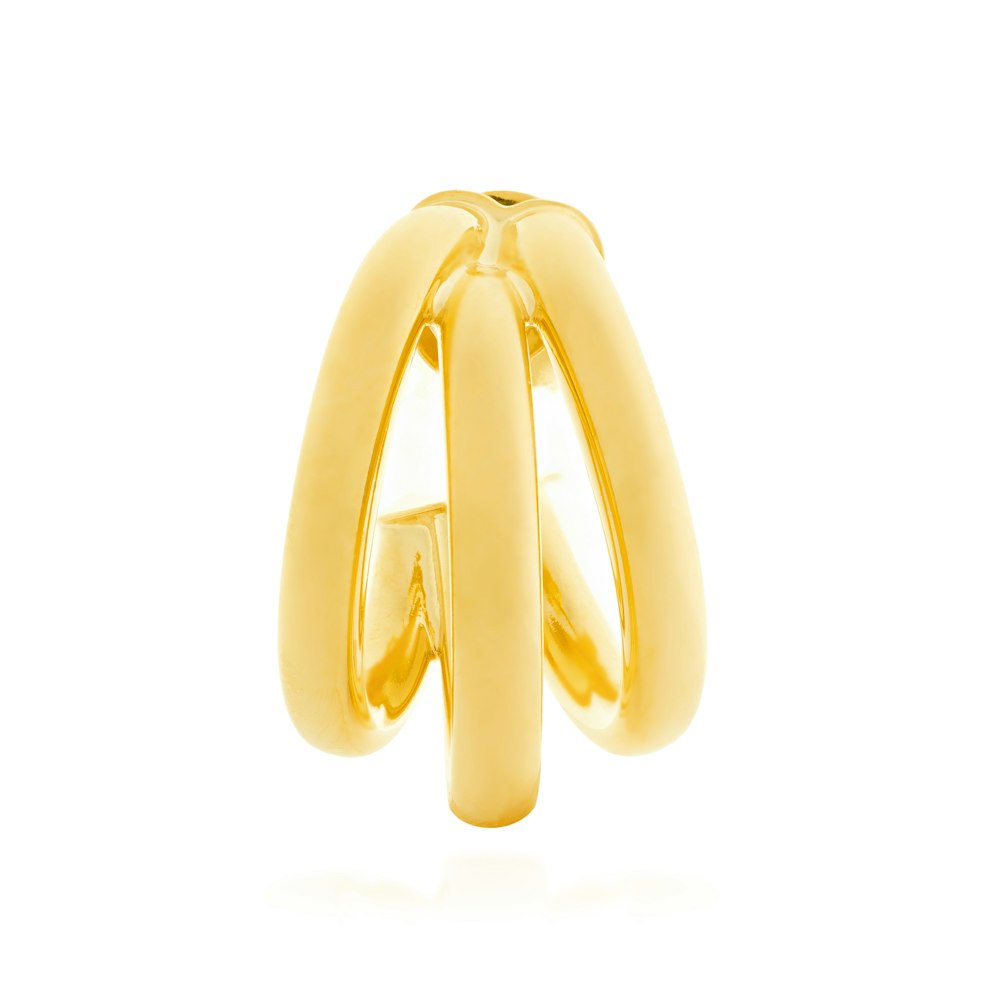 a pair of gold rings on a white background