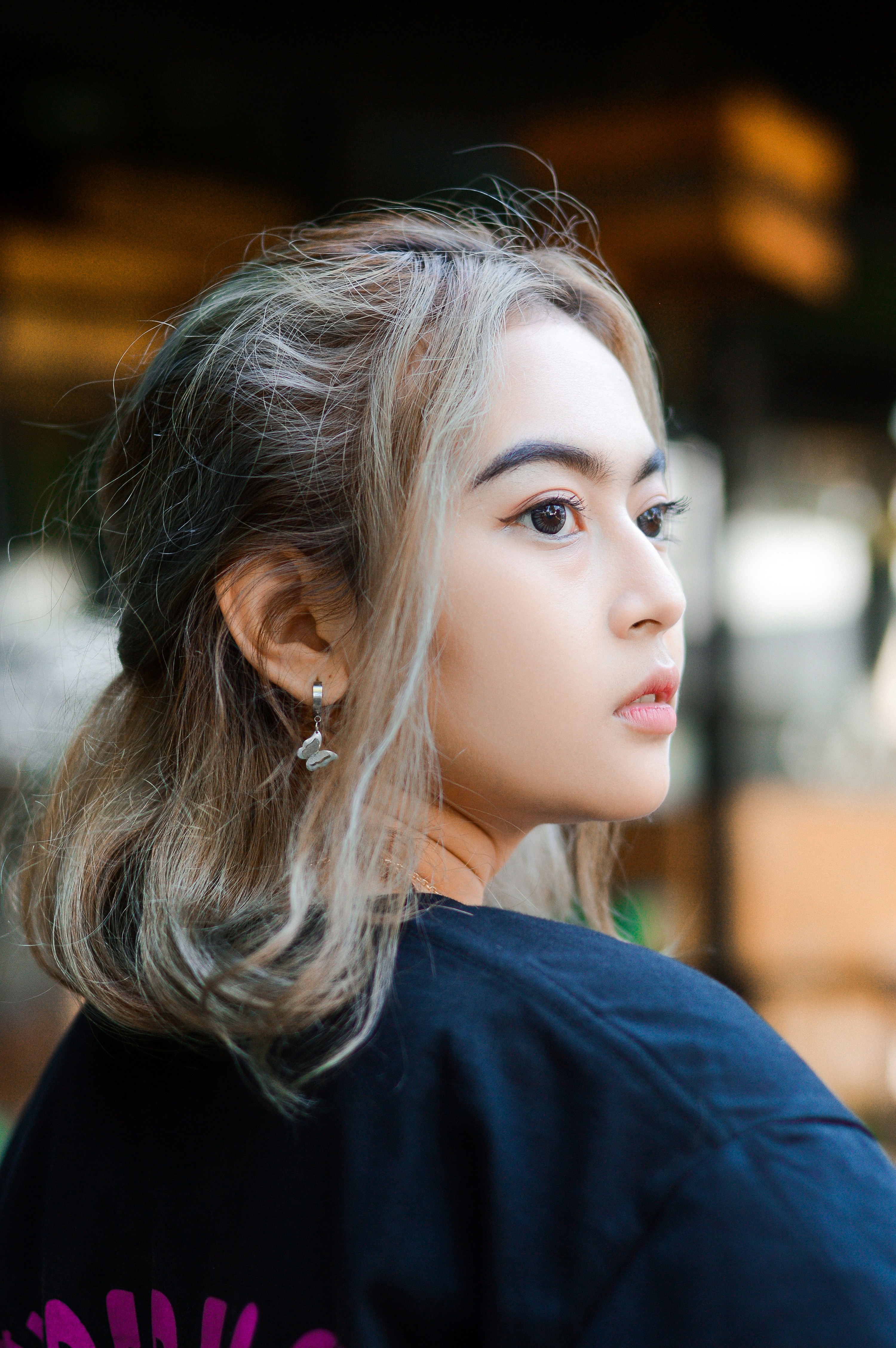 A woman with long hair wearing a black shirt photo – Free Garut Image ...