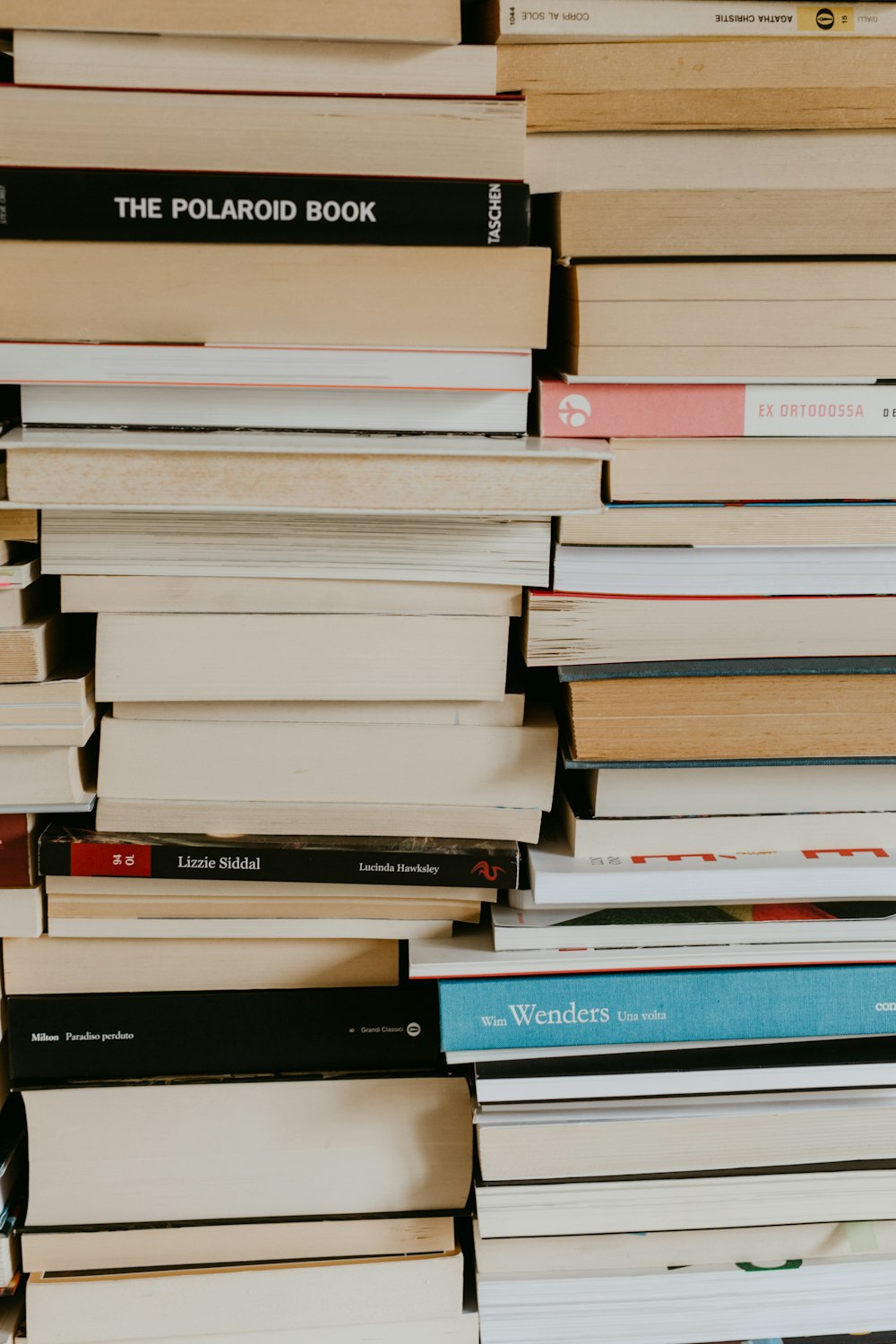 a stack of books sitting on top of a table