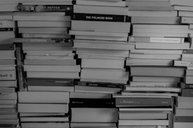 Stacks of textbooks and novels ready for distribution in a warehouse