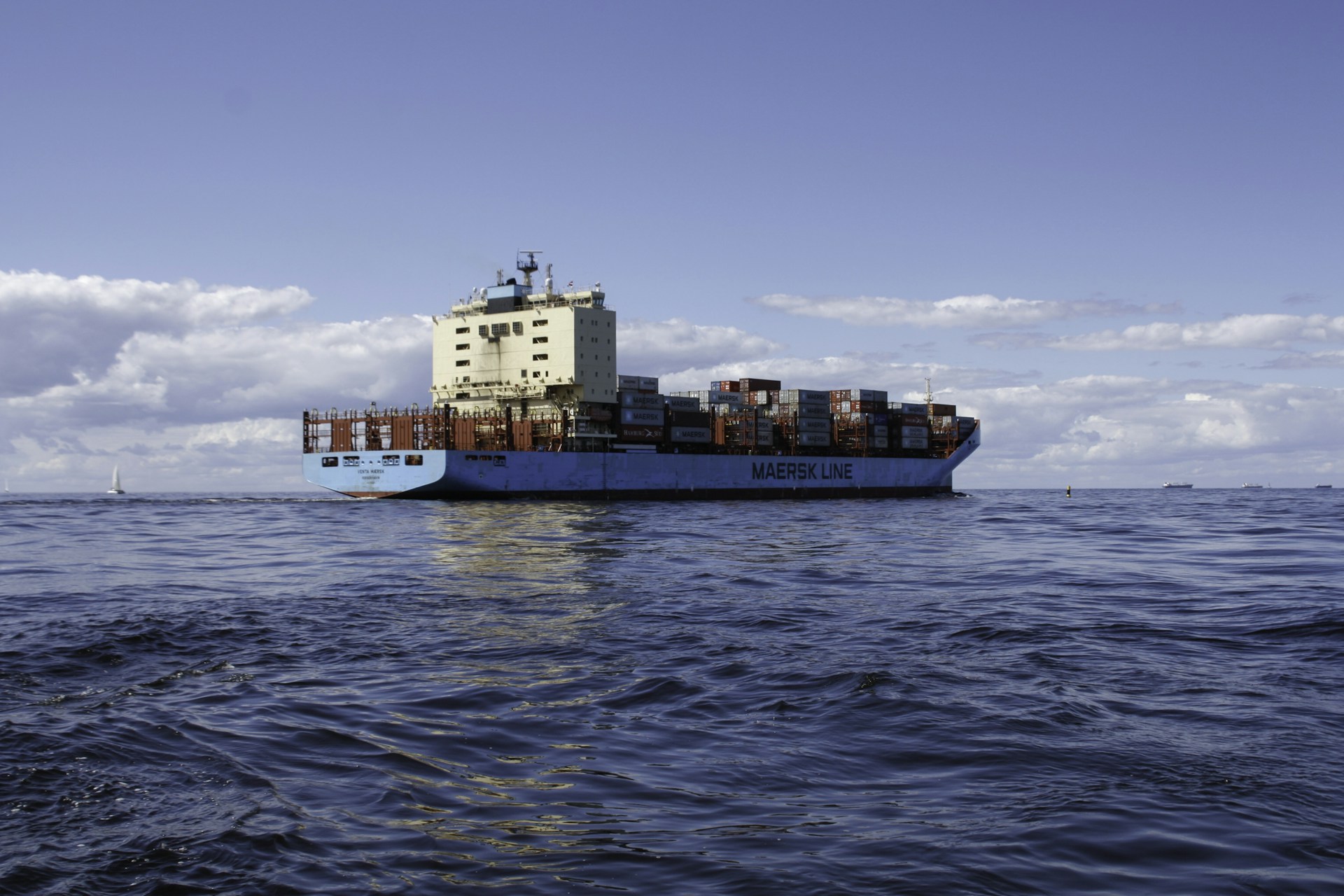 a large cargo ship in the middle of the ocean