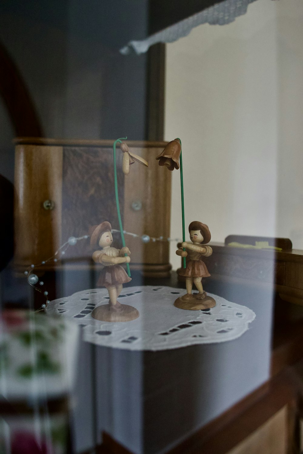 a couple of figurines sitting on top of a table