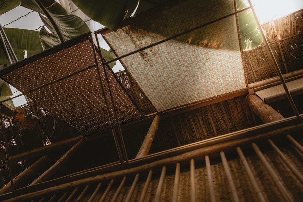 a close up of a bamboo structure with a sky background