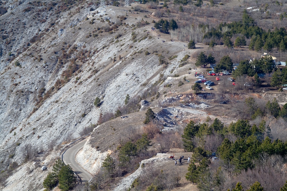 an aerial view of a mountain with a road going through it