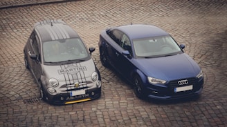 a couple of cars parked next to each other