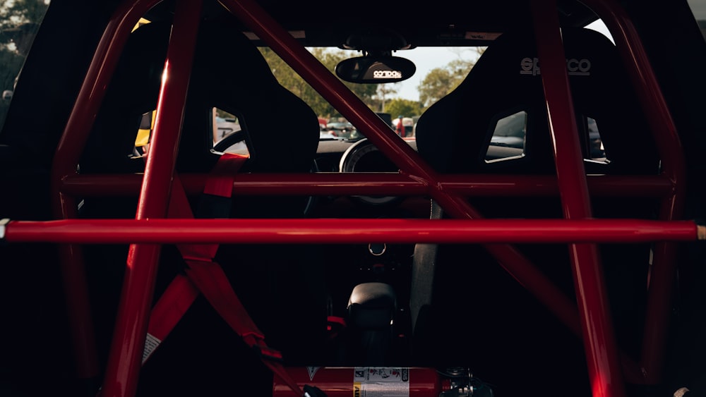 the inside of a car with a red frame