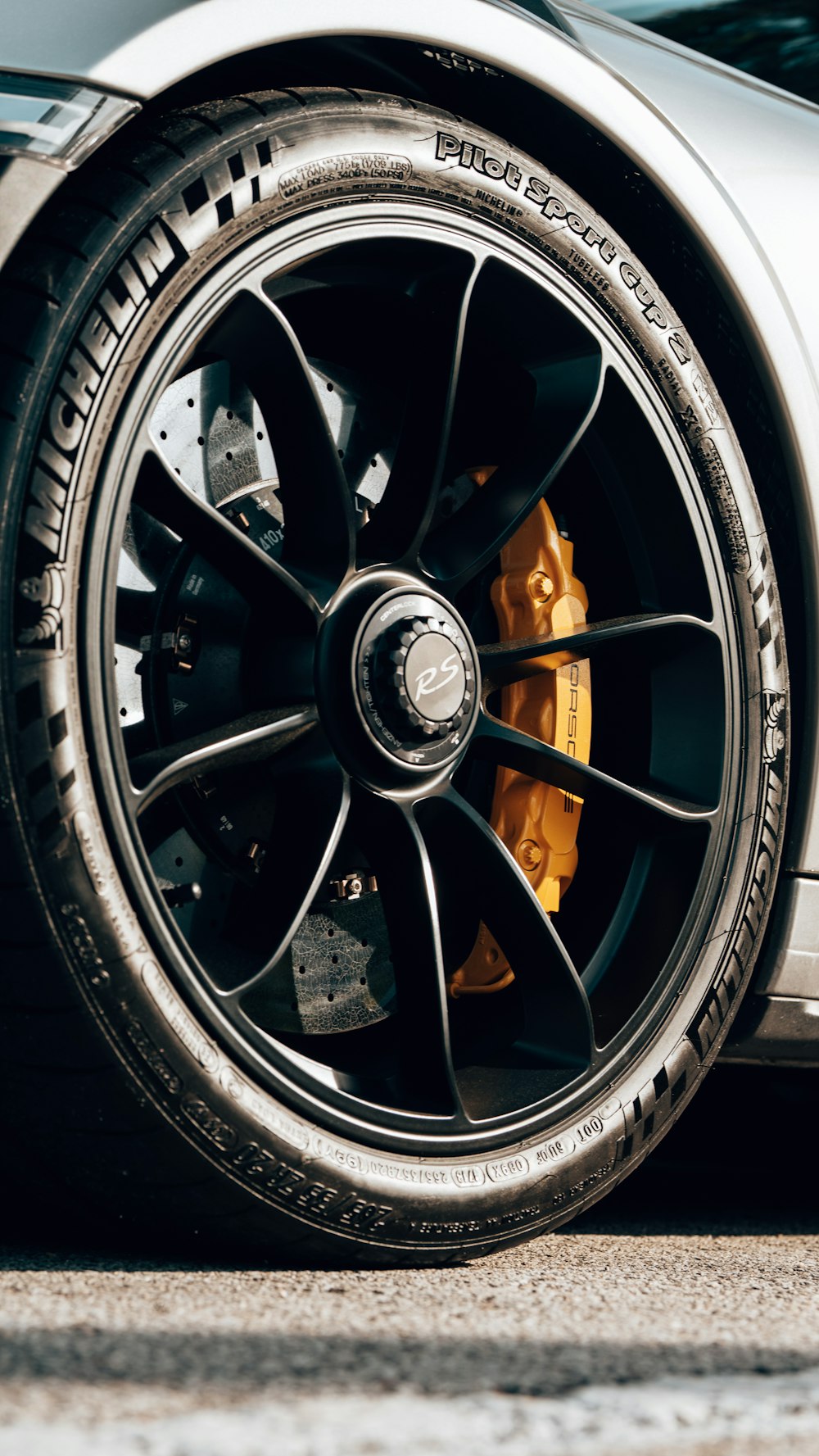 a close up of a tire on a sports car