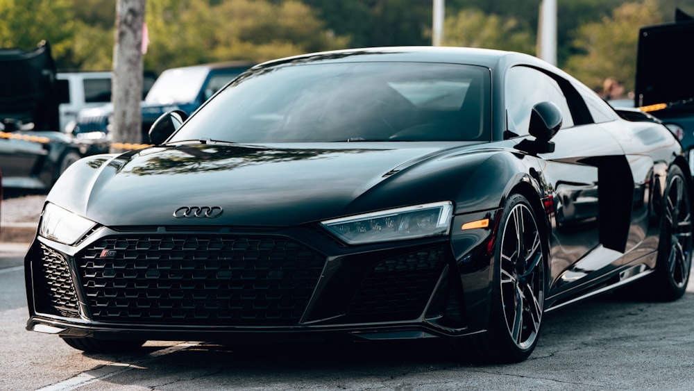 a black sports car parked on the side of the road