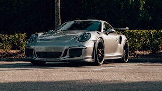 A sleek, shiny Japanese import car parked in a sunlit lot, ready for sale.