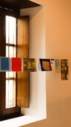 a window with a bunch of pictures hanging on it