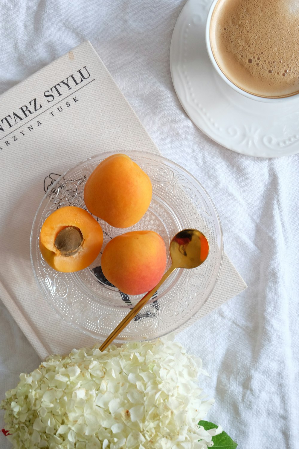 a plate of fruit and a cup of coffee