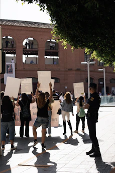 a group of people holding up signs in the air